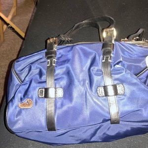 Dooney &burke nylon satchel with a cross body strap
